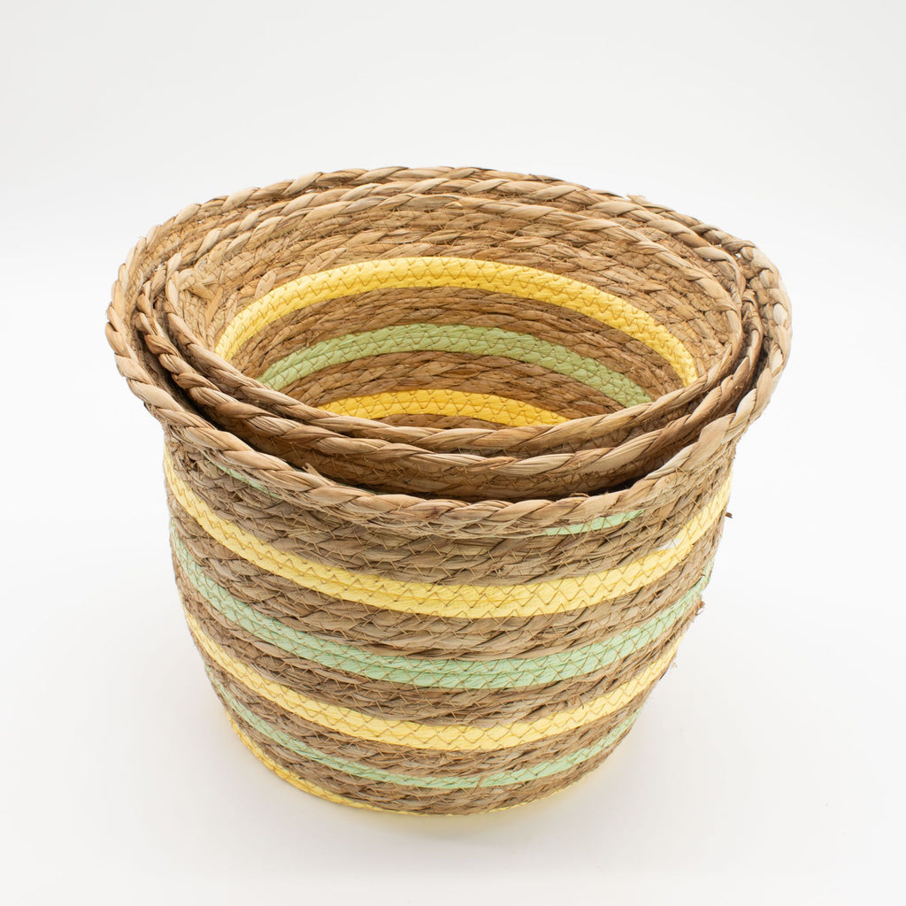Set of woven baskets with striped pattern on a white background