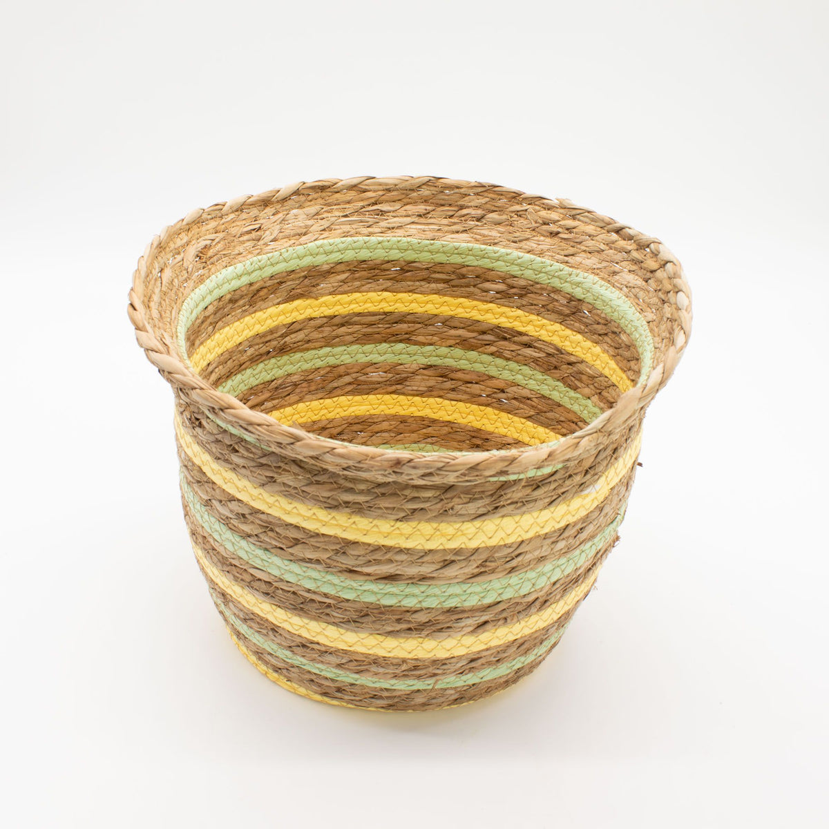 Woven basket with striped pattern on a white background