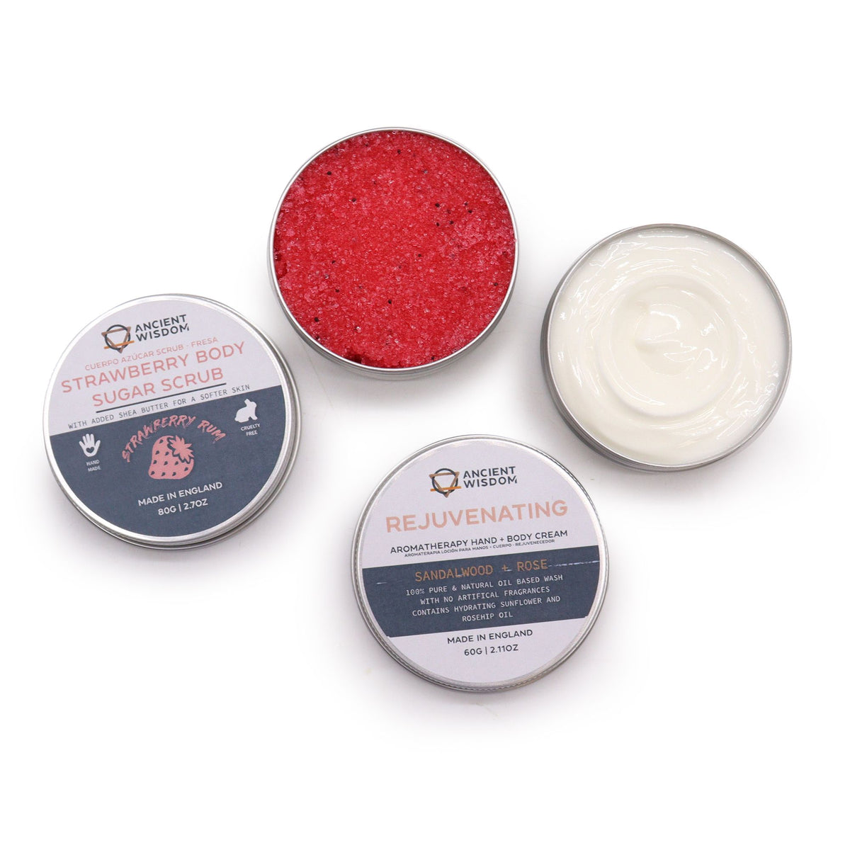 Three containers of Ancient Wisdom body products including a sugar scrub and cream on a white background