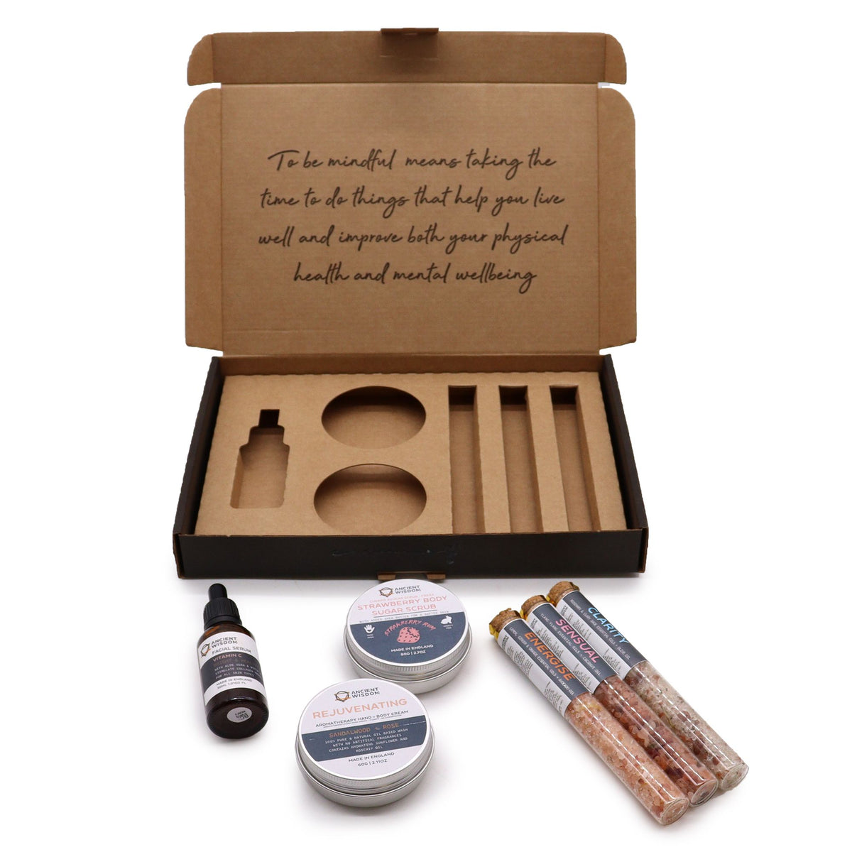 Open cardboard box with compartments, accompanied by various wellness products on a white background.