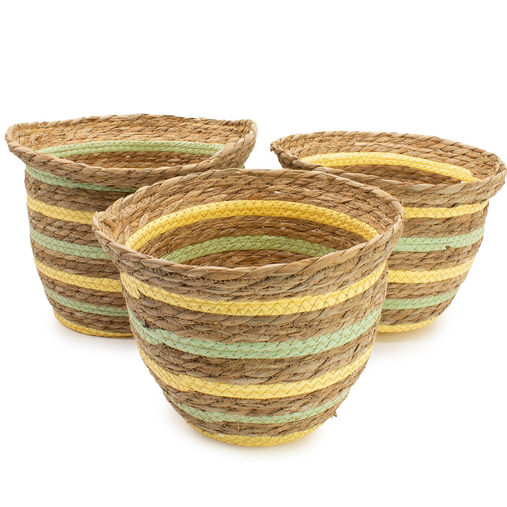 Three woven baskets with striped patterns on a white background