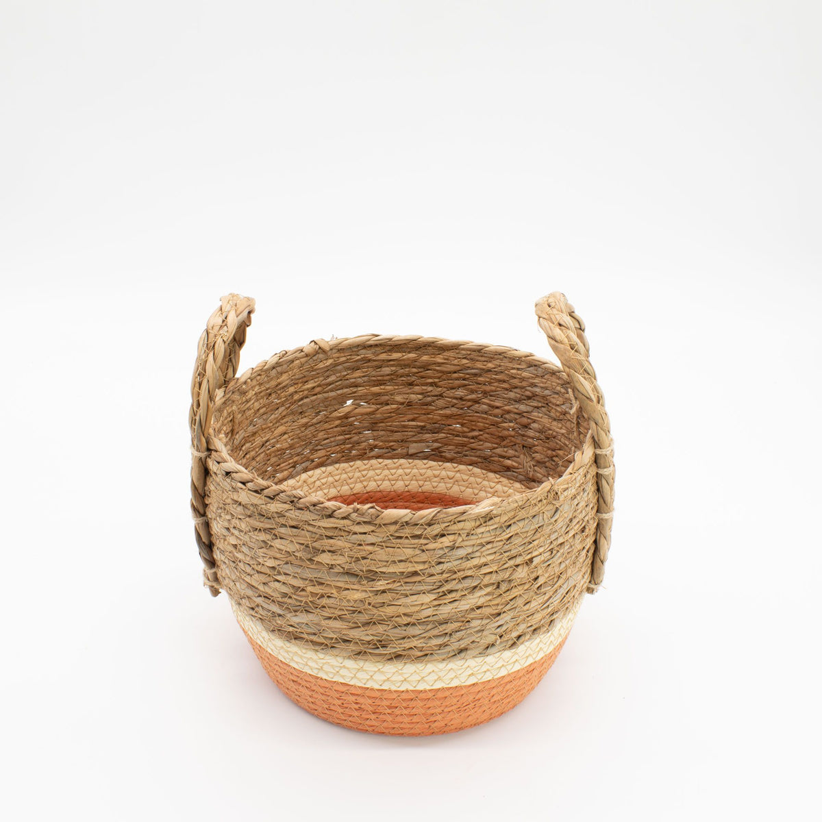 Woven basket with two-tone design on a white background