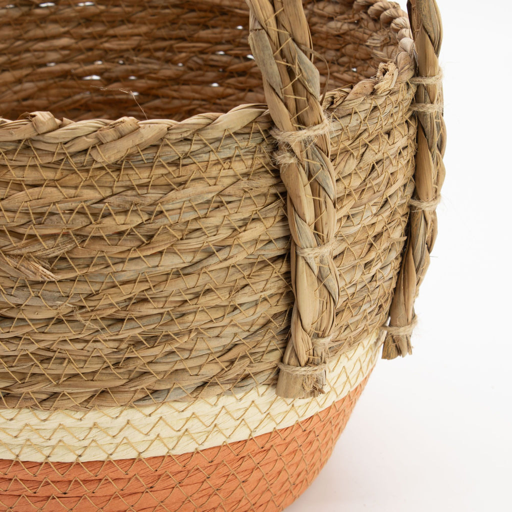 Close-up of a woven basket with a white background