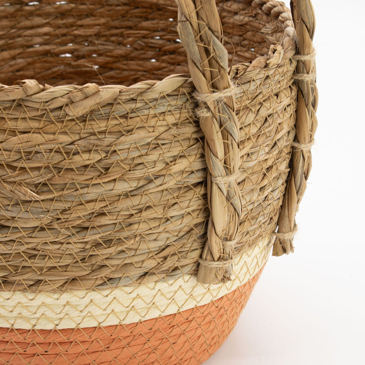 Close-up of a woven basket with a white background